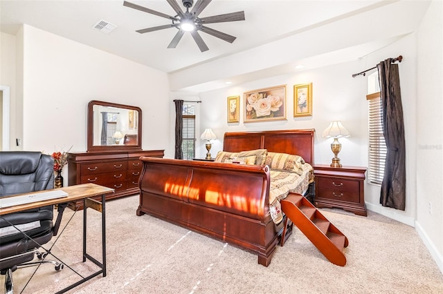 bedroom featuring light carpet and ceiling fan