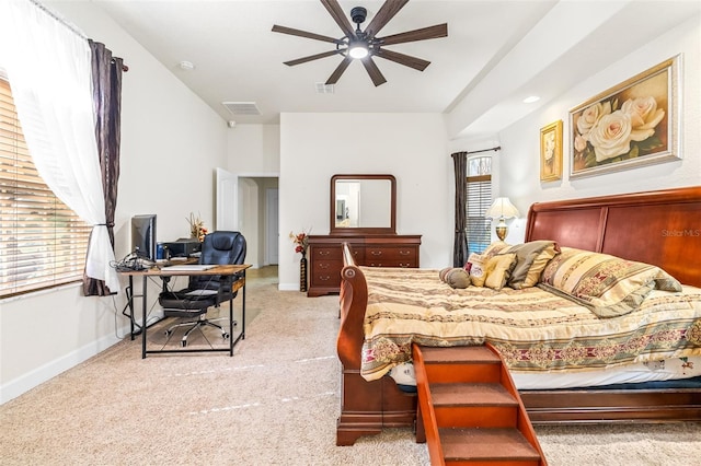 bedroom with ceiling fan and light colored carpet