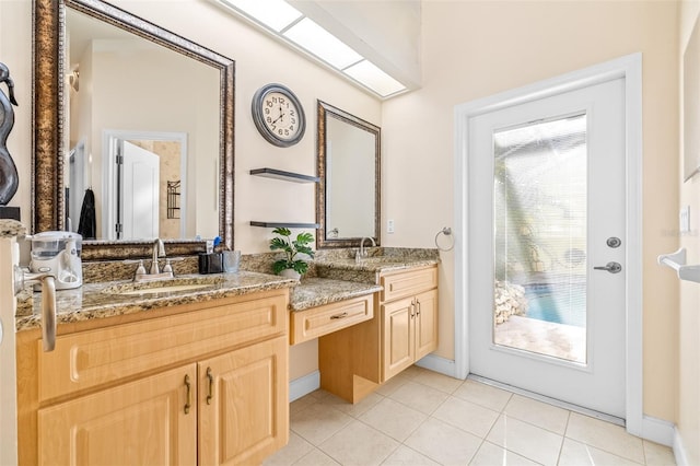 bathroom with tile patterned flooring and vanity