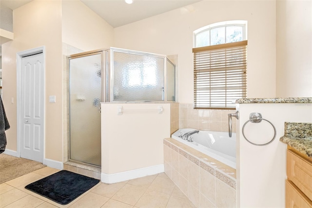 bathroom with tile patterned flooring, vanity, and independent shower and bath