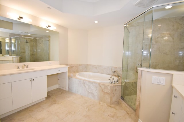 bathroom featuring separate shower and tub and vanity