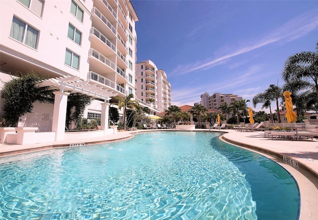 view of swimming pool featuring a pergola and a patio area