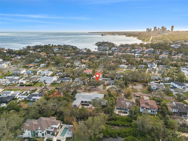 birds eye view of property featuring a water view and a residential view