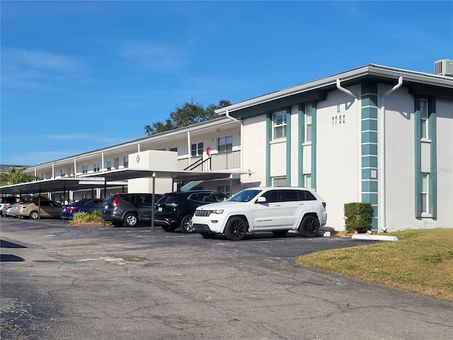 view of parking / parking lot with a carport