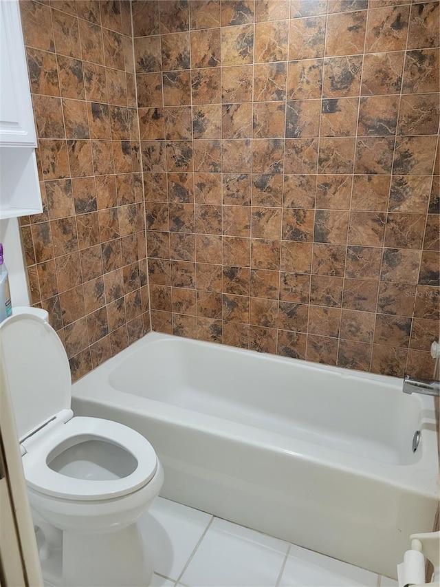 bathroom with tile patterned flooring and toilet