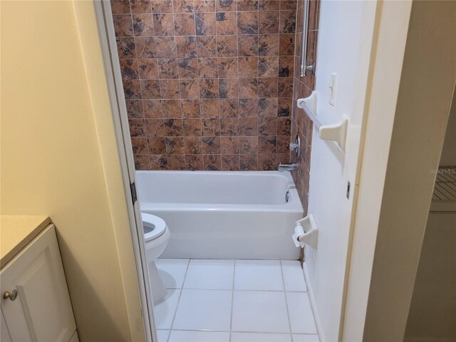 full bathroom featuring tile patterned flooring, vanity, toilet, and tiled shower / bath