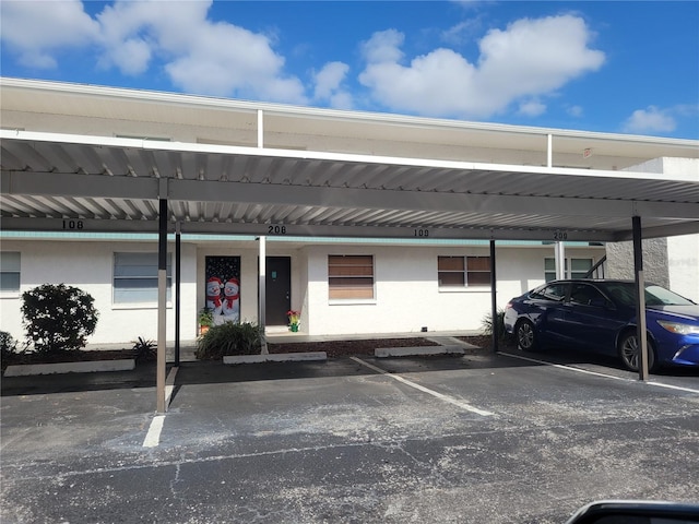 view of parking / parking lot with a carport