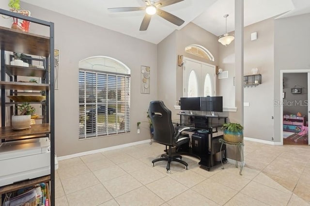 tiled office with a wealth of natural light, ceiling fan, and french doors