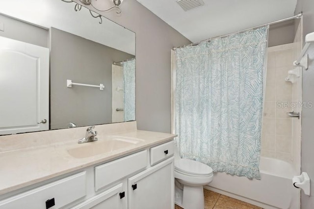 full bathroom with tile patterned floors, vanity, toilet, and shower / bath combination with curtain