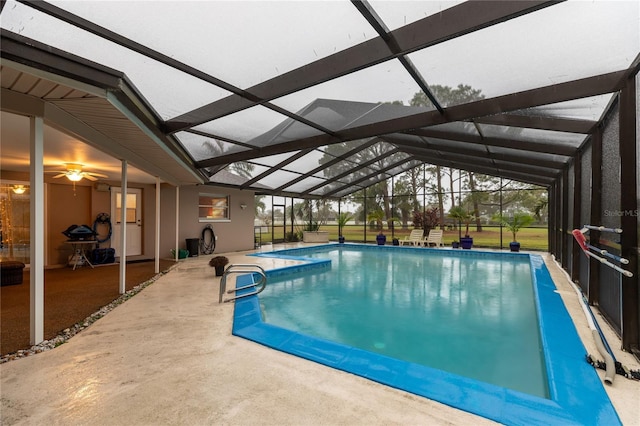 view of pool with a lanai and a patio