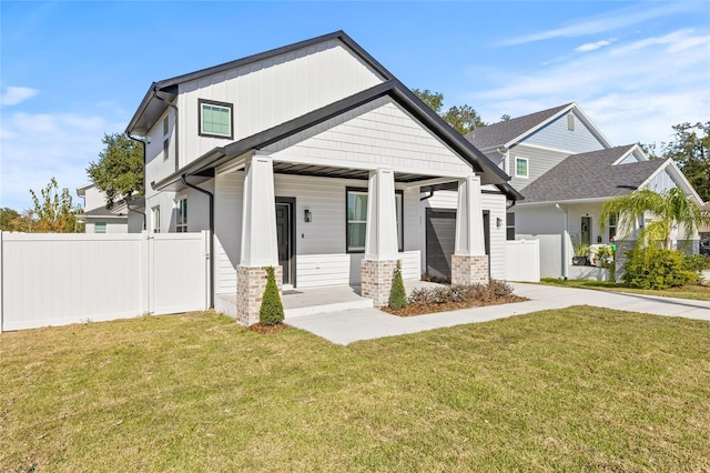 craftsman house featuring a porch and a front yard