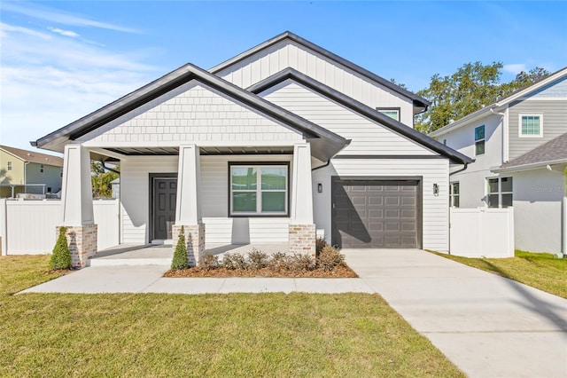 craftsman-style home with a porch, a garage, and a front lawn