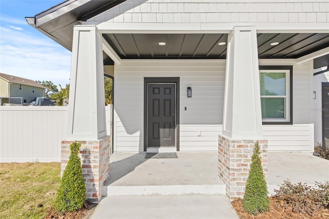 entrance to property with a porch