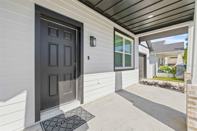 doorway to property with a porch