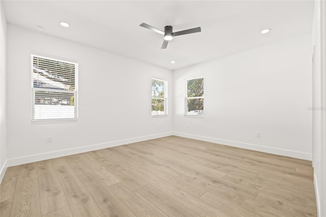 unfurnished room featuring light hardwood / wood-style floors and ceiling fan