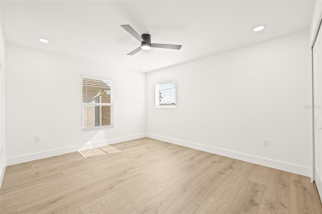 empty room with light hardwood / wood-style flooring and ceiling fan