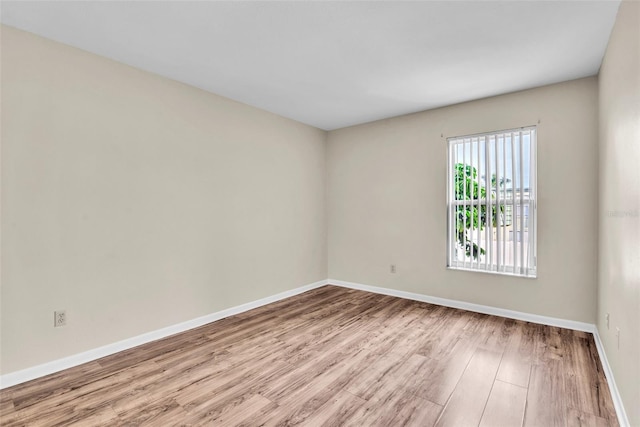 spare room featuring light hardwood / wood-style floors