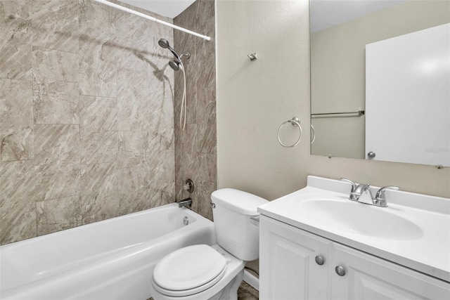 full bathroom with vanity, toilet, and tiled shower / bath