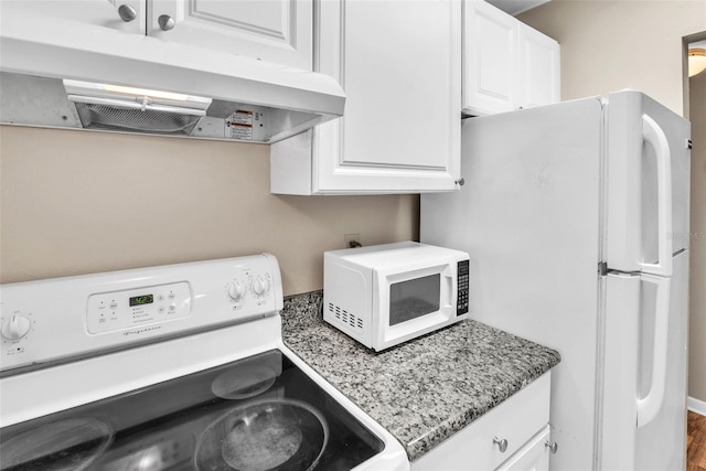 kitchen with stone countertops, white cabinetry, wood-type flooring, and white appliances