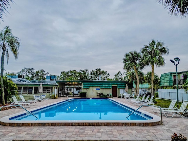 view of swimming pool with a patio