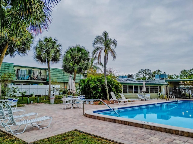 view of swimming pool featuring a patio area