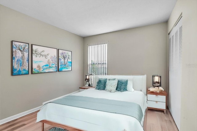 bedroom with light hardwood / wood-style flooring