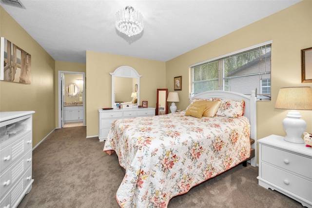 bedroom featuring a notable chandelier and carpet floors