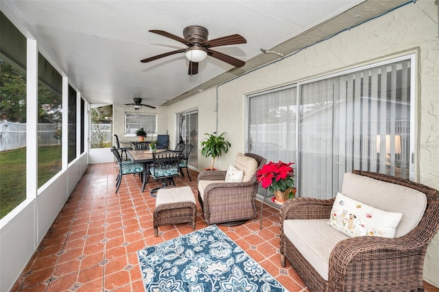 sunroom / solarium with ceiling fan