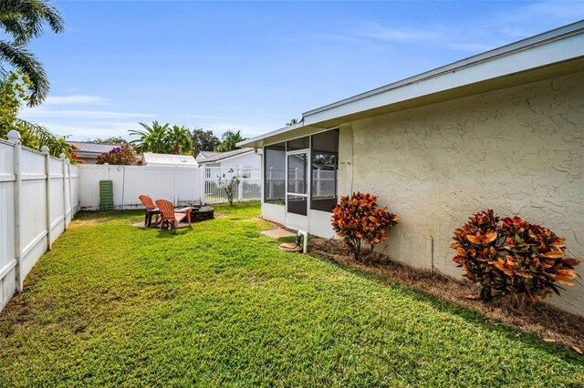 view of yard with a sunroom