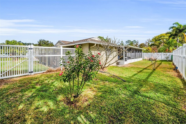 view of yard featuring a sunroom