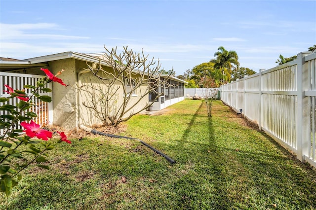 view of yard with a sunroom