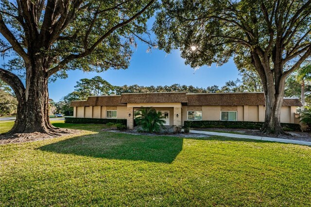 view of front of home featuring a front lawn