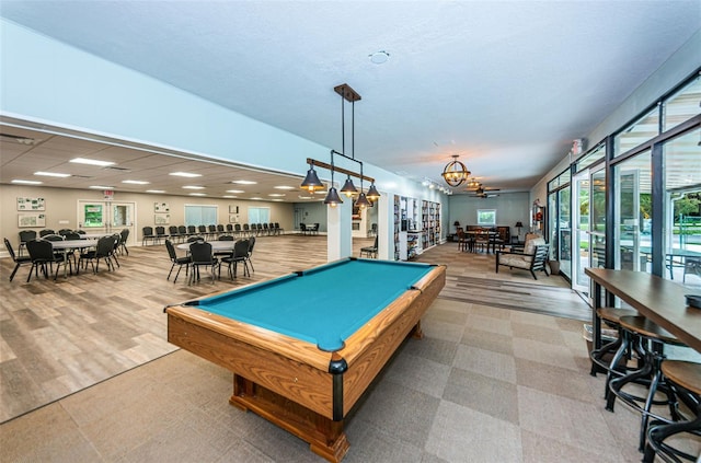 game room with billiards and light hardwood / wood-style floors