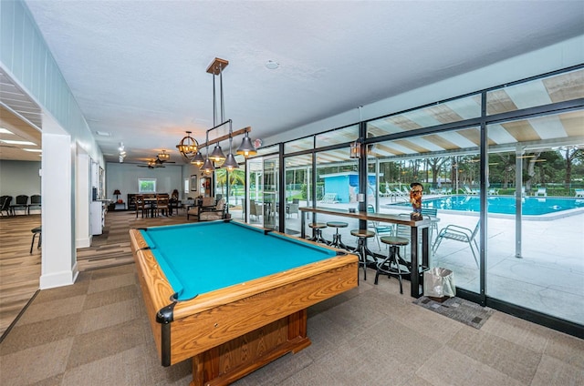 playroom featuring pool table and a textured ceiling