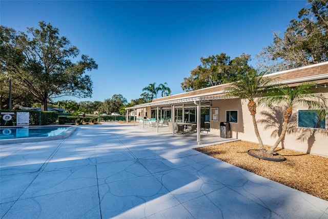 view of swimming pool with a pergola and a patio area