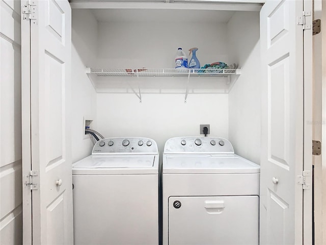 laundry area featuring washing machine and clothes dryer