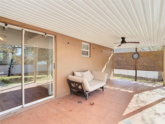 view of patio featuring ceiling fan