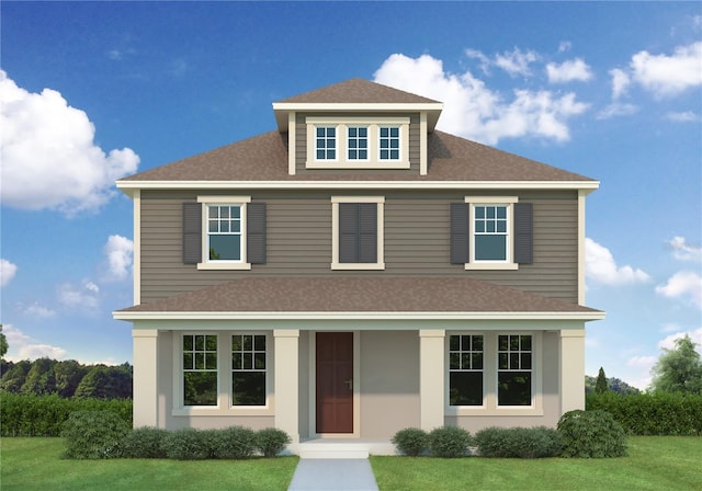 view of front of house featuring a front yard and a shingled roof