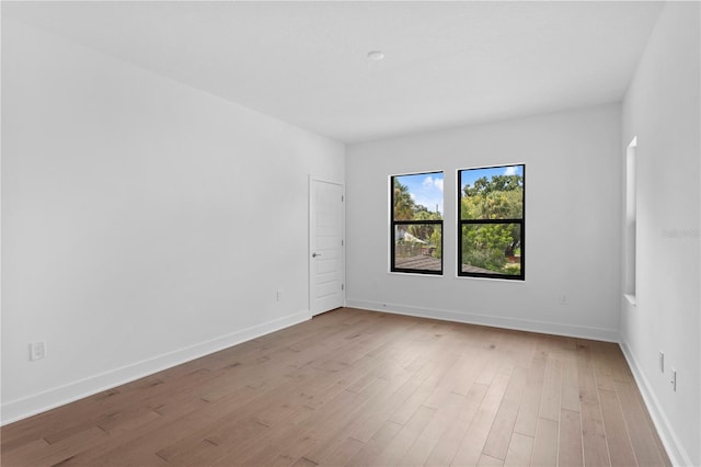 empty room with light hardwood / wood-style floors