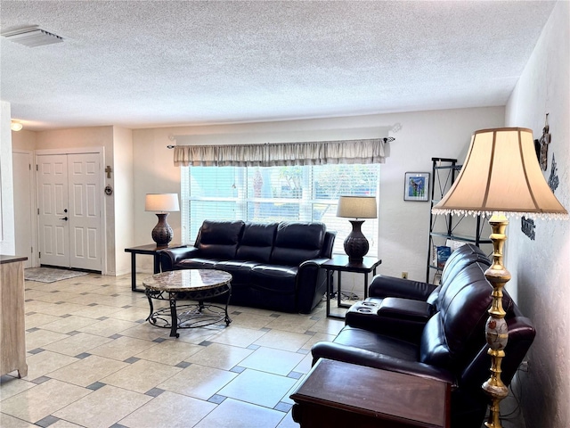 living room featuring a textured ceiling