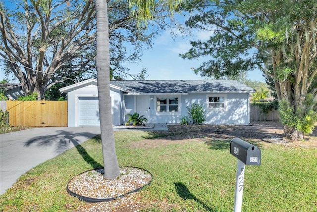 single story home with a front yard and a garage