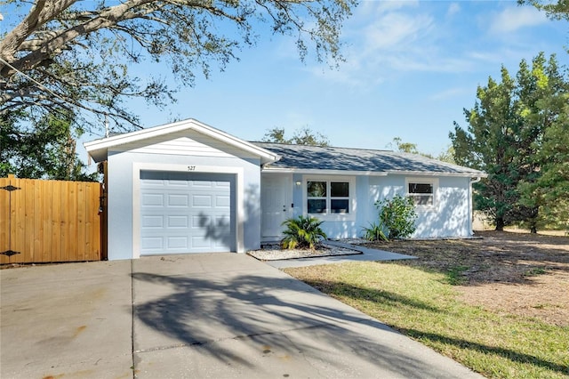 ranch-style home featuring a garage