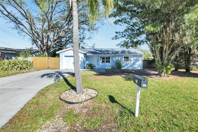 ranch-style home with a front yard and a garage