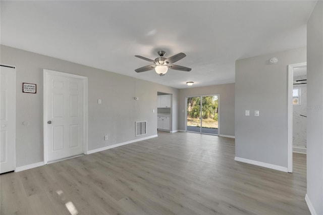 unfurnished living room with ceiling fan and light hardwood / wood-style flooring