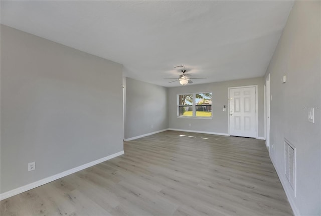 spare room featuring light wood-type flooring and ceiling fan