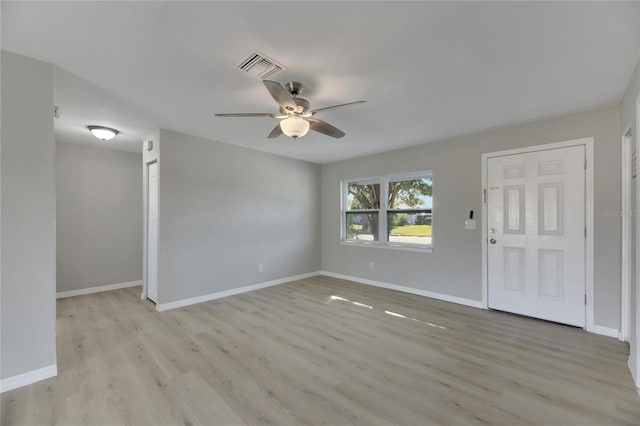 spare room featuring ceiling fan and light hardwood / wood-style flooring