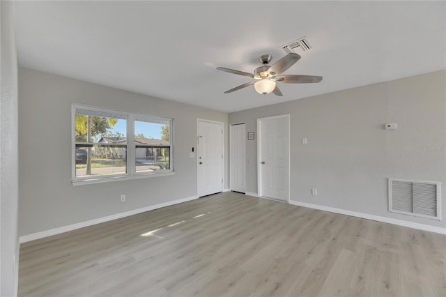 unfurnished room with ceiling fan and light hardwood / wood-style flooring