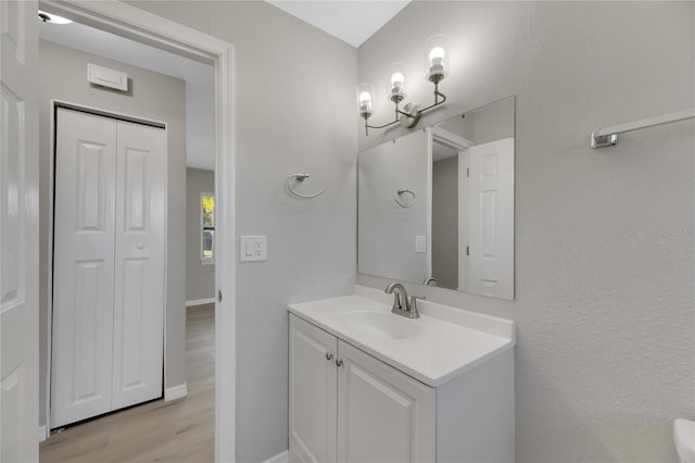 bathroom featuring hardwood / wood-style floors and vanity