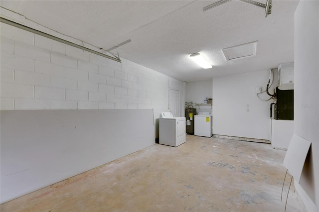 garage with washer / clothes dryer and water heater