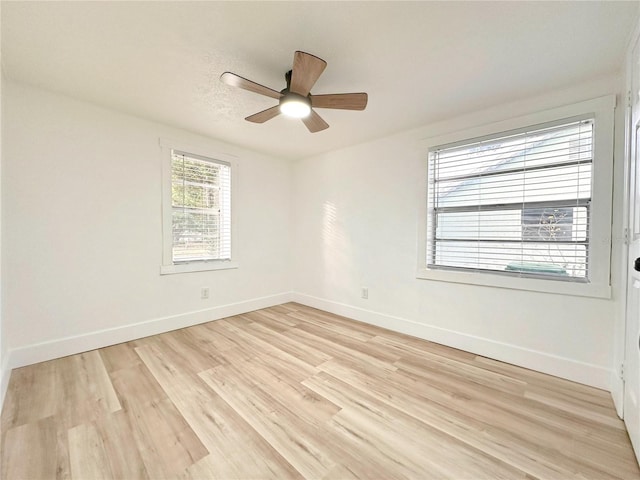 unfurnished room featuring ceiling fan and light hardwood / wood-style floors